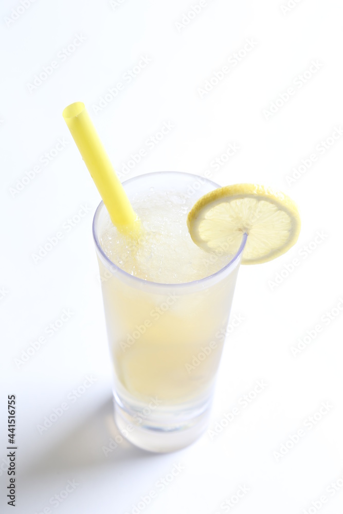 ice cold chilled fresh sour lemon fruit honey drink in glass and yellow straw beverage menu in white background ice cold chilled fresh sour lemon fruit honey drink in glass and yellow straw beverage menu in white background