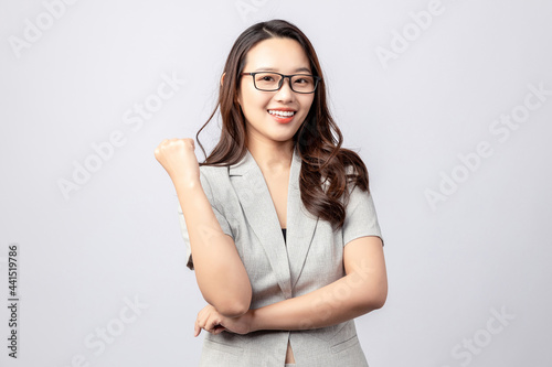 Beautiful business woman on gray background