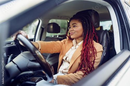 Fotografia, Obraz Portrait of positive african american lady inside the car