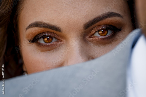 Piercing female gaze of brown eyes