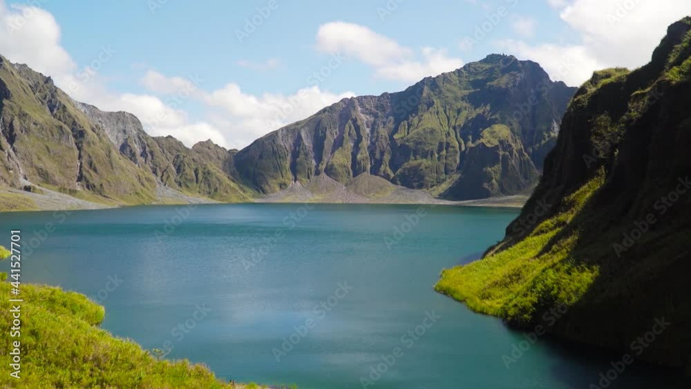 Lake Pinatubo, summit crater lake of Mount Pinatubo volcano, Philippines. Beautiful landscape at Pinatubo mountain crater lake. Travel concept. Lake Pinatubo, summit crater lake of Mount Pinatubo volcano, Philippines. Beautiful landscape at Pinatubo mountain crater lake. Travel concept.