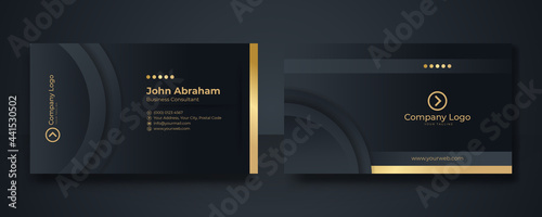 Black and gold business card background template. clean dark gold business card. Gold black modern creative business card and name card, horizontal simple clean template vector design