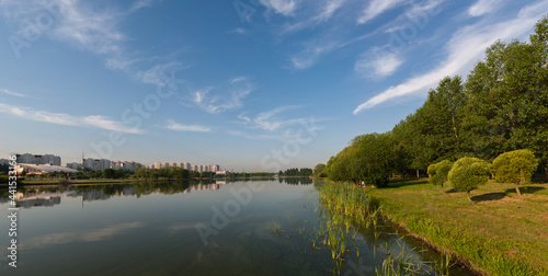 Morning panorama in the city pond park