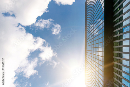 Companies buildings. Finance corporate architecture city in abstract blue sky with nature cloud in sunny day. Modern office business building with glass, steel facade exterior.