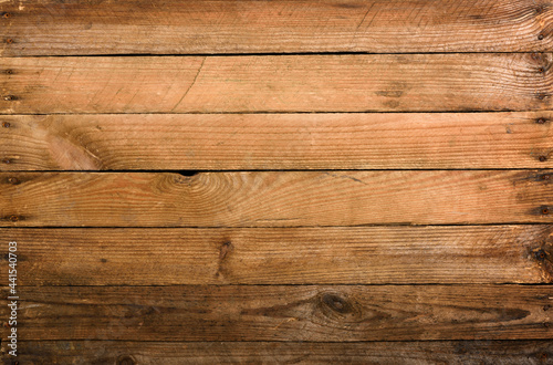 Weathrered old wooden planks background with nails top view. photo