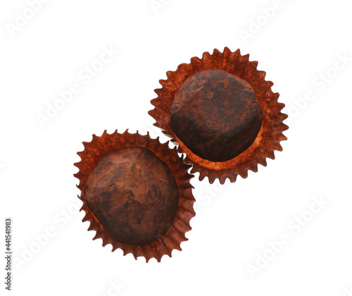 Delicious chocolate candies on white background, top view