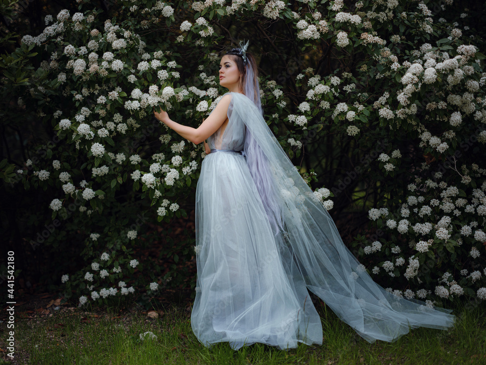 a beautiful woman like a fairy or nymph walking in the park a beautiful woman like a fairy or nymph walking in the park