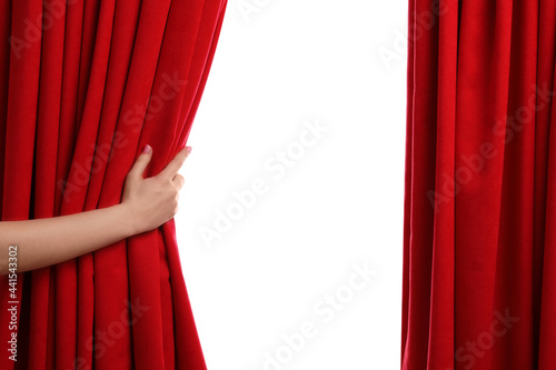 Woman opening red front curtains on white background, closeup