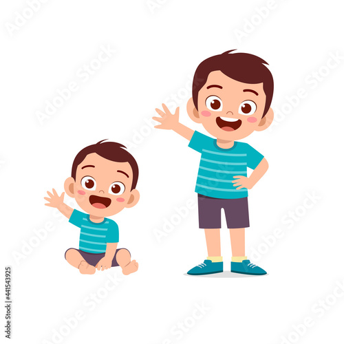 cute little boy say hello with young brother