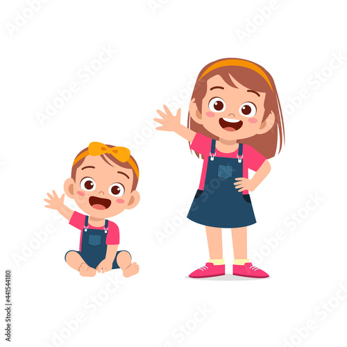 cute little girl say hello with young sister
