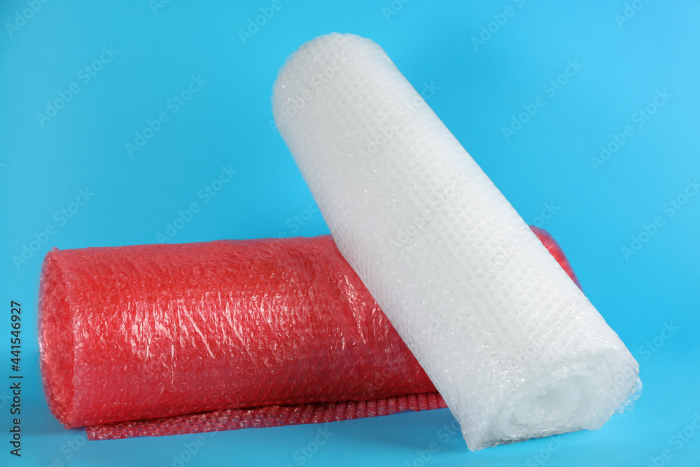 Obraz premium Bubble wrap rolls on light blue background