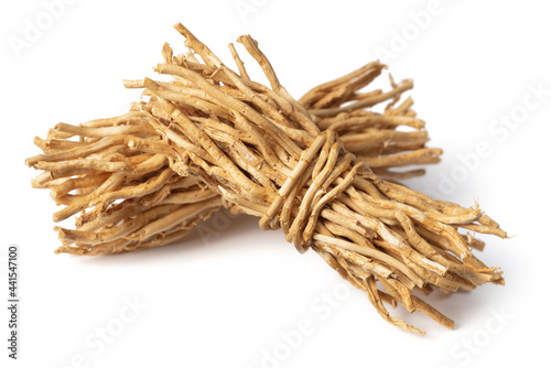 bunch of dried vetiver roots isolated on white background photo