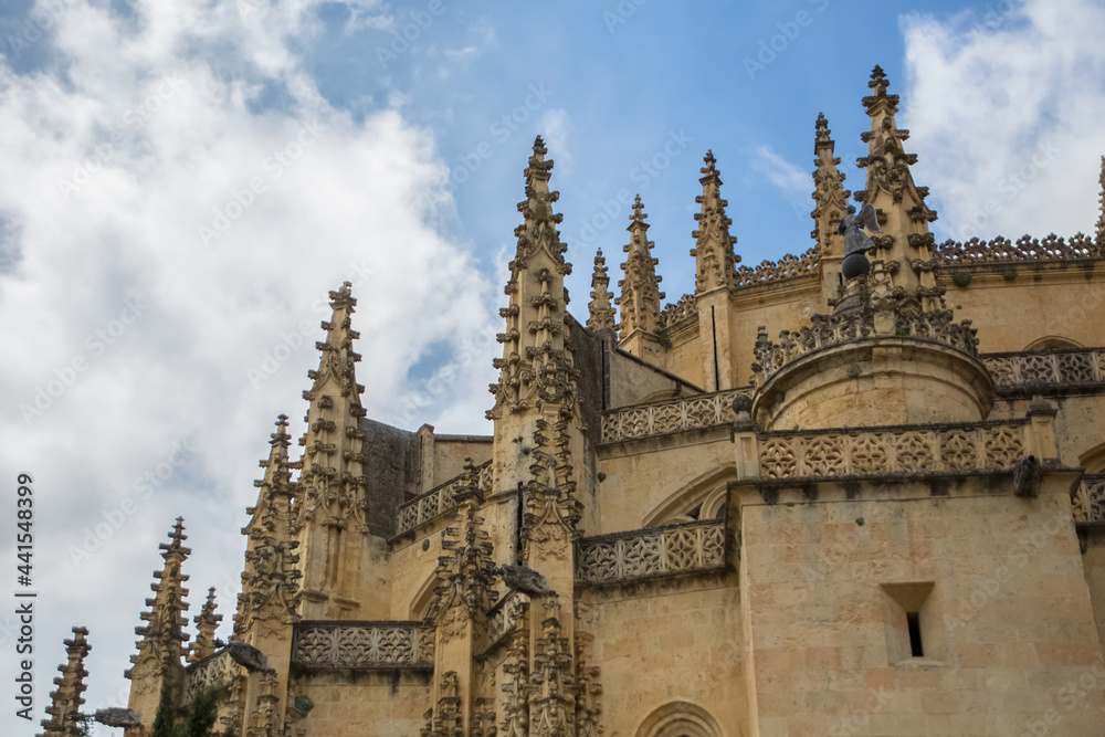 Majestic detailed front view at the iconic spanish gothic ornaments building at the Segovia cathedral, towers and domes