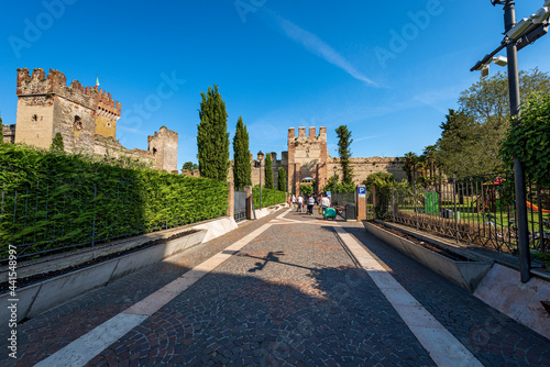 Medieval Scaligero Castle and Fortified Walls (IX-XIV century), of the small Lazise village, tourist resort on the coast of Lake Garda (Lago di Garda). Verona province, Veneto, Italy, southern Europe.