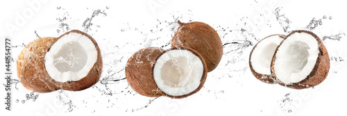 Obraz na płótnie Fresh coconuts with water splash on isolated white background
w salonie