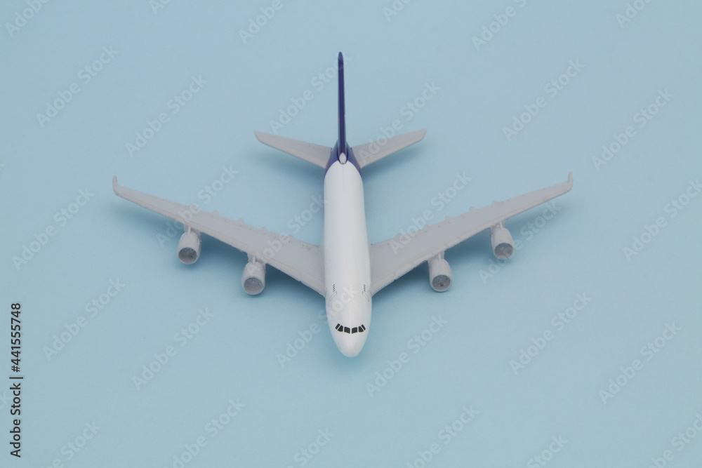 Airplane model on blue background., front view Airplane model on blue background., front view