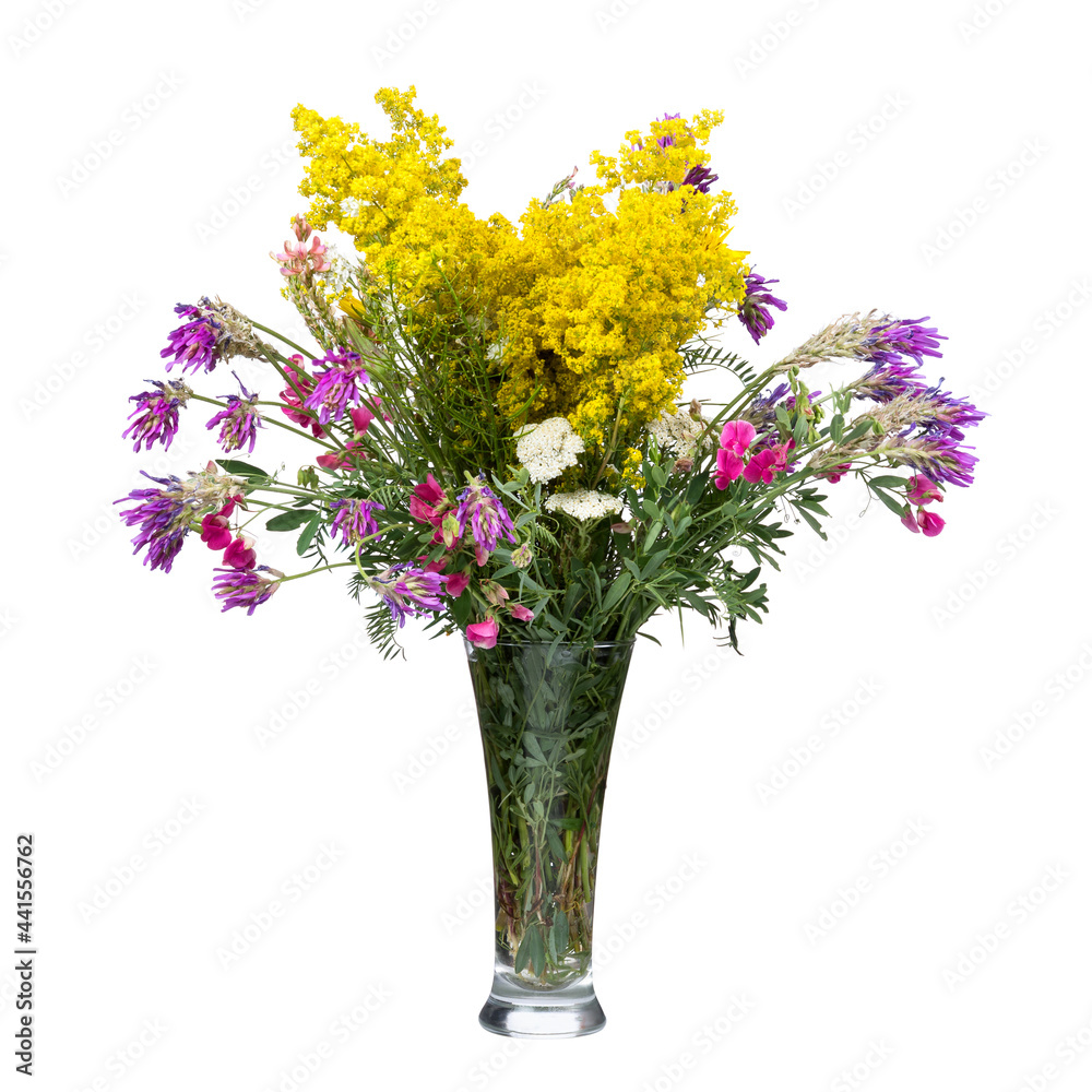 Bouquet of wild flowers in a glass vase isolated on white