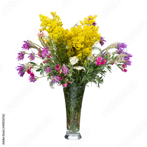 Bouquet of wild flowers in a glass vase isolated on white