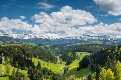 view over Trub with hills and forests of Emmental towards the bernese alps photo