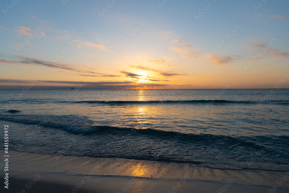 amazing seascape with cloudy sky over sea sunrise water with ships on horizon, sunset or sunrise.