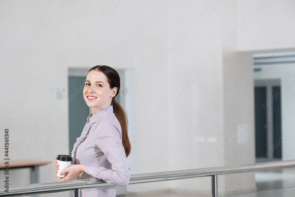 young attractive business woman with a cup of coffee young attractive business woman with a cup of coffee