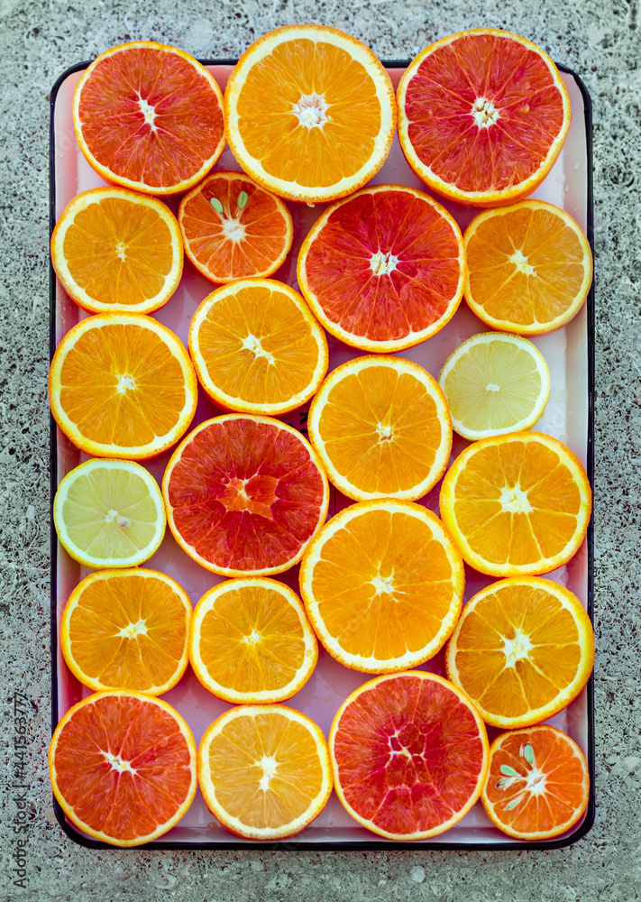 Oranges and lemons on light marble background. Oranges and lemons on light marble background.