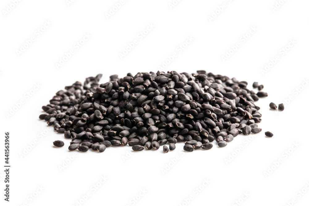 Pile of basil seeds isolated on white ready to plant Pile of basil seeds isolated on white ready to plant