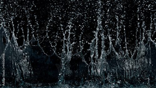 Abstract water splashes isolated on black background © Jag_cz