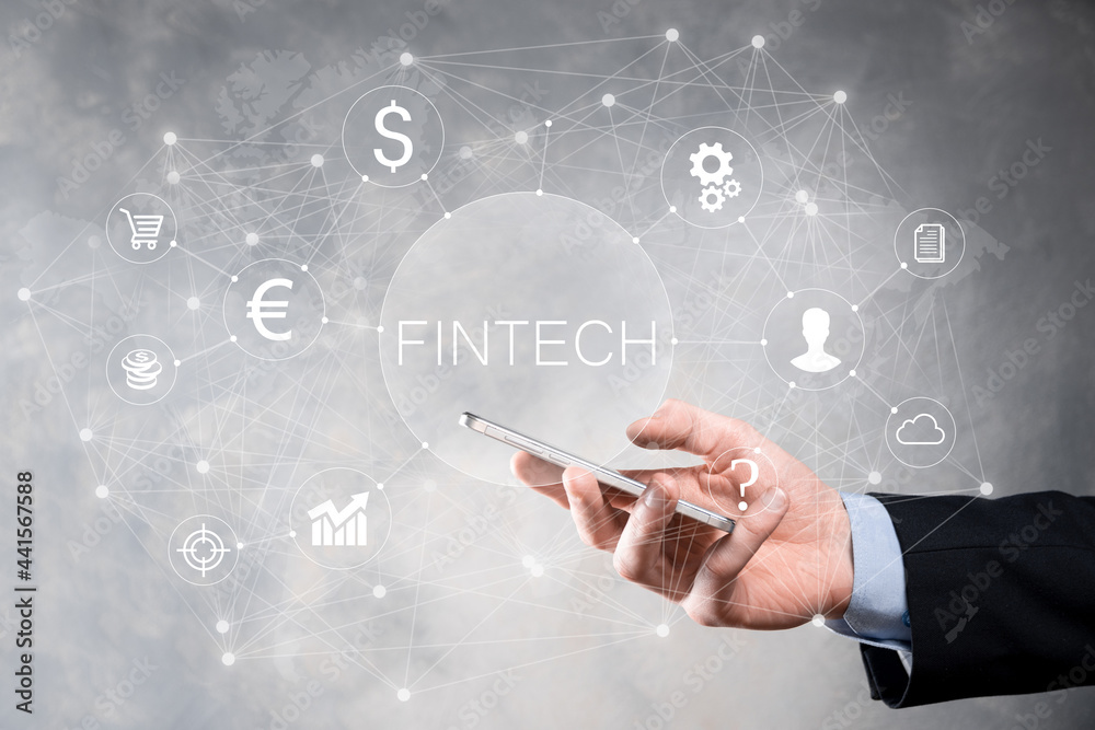 Obraz premium Businessman hold Fintech -financial technology concept.Business investment banking payment. Cryptocurrency investment and digital money. Business concept on virtual screen.