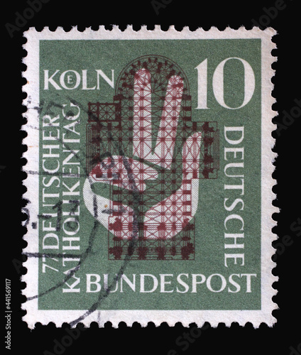 Stamp printed in Germany  shows a hand raised to the oath in front of the floor plan of the Cologne Cathedral. occasion was the 77th German Catholic Day in Cologne  circa 1956