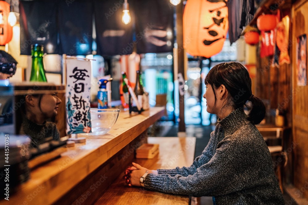 Lady at counter in bar Lady at counter in bar