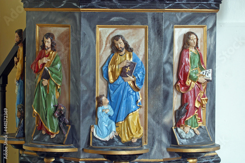 Evangelists, statues at the pulpit in the chapel of Saint George at the Lake in Klanjecko Jezero, Croatia photo