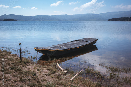 Boat on the lake shore. Calm, relax scenery. Vlasina lake, Eastern Serbia