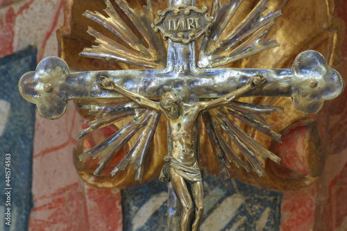Cross on the altar in the Baroque church of Our Lady of the Snows in Belec, Croatia photo