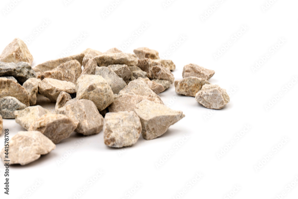 Gray small rocks ground texture isolated on white background. Small road stone.