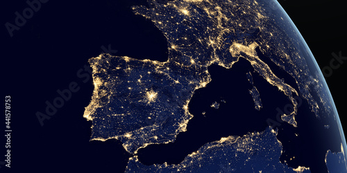 Iberian Peninsula and europe at night in the earth planet rotating from space