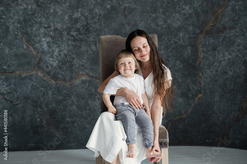 Studio Portrait of young mom and little baby son © Annatamila