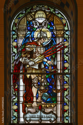 Fototapeta Saint Michael the Archangel, stained glass window in the parish church of the As