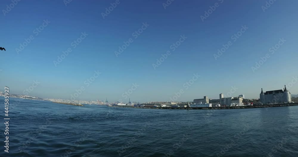 ISTANBUL - FEBRUARY 26, 2021: View on Haydarpasa railway station on the horizon in Kadikoy district of Istanbul. Ultra wide, DCI 4K ISTANBUL - FEBRUARY 26, 2021: View on Haydarpasa railway station on the horizon in Kadikoy district of Istanbul. Ultra wide, DCI 4K