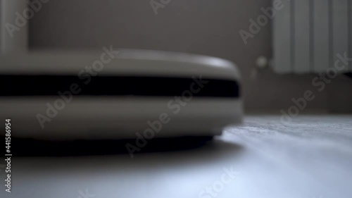 robot vacuum cleaner cleans the apartment
