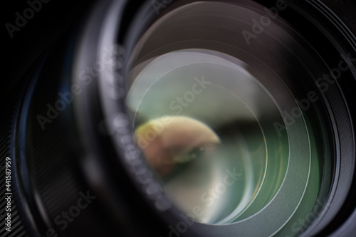 Camera lens with multi colored light of glass. Background pattern for design