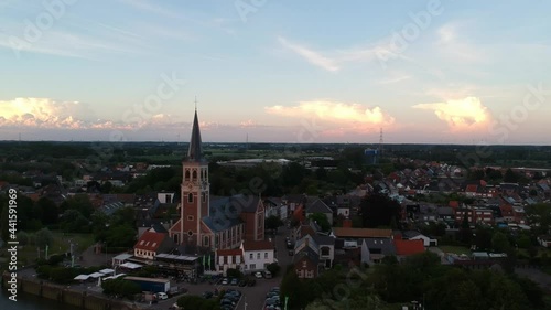 Wallpaper Mural Beautiful church town on river coastline during sunset time, reveal aerial view Torontodigital.ca