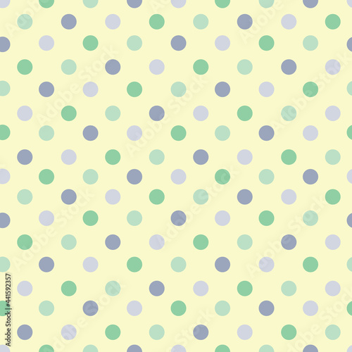 Colorful green blue grey dots on light yellow repeat seamless pattern design