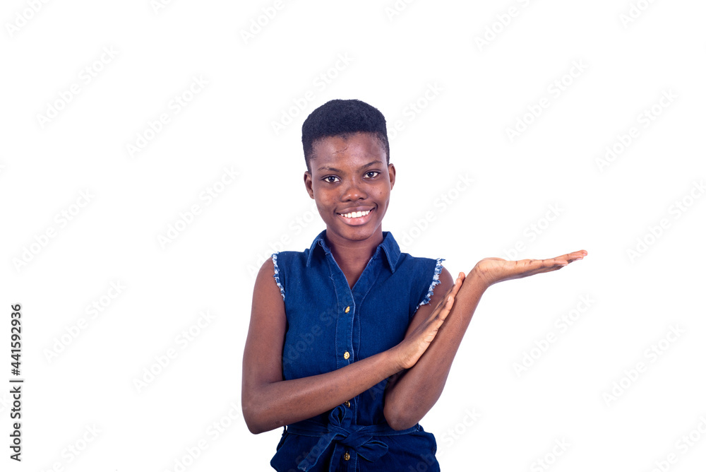 beautiful happy young girl showing empty palm while smiling. beautiful happy young girl showing empty palm while smiling.