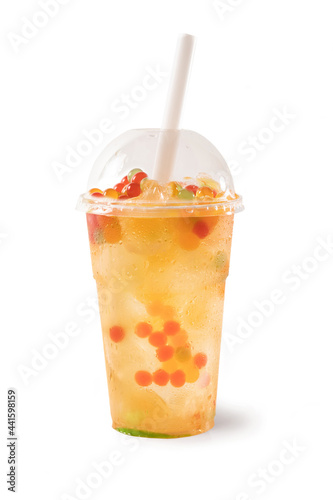 Bubble Tea, Isolated on White Background – Colorful, Fresh Orange Boba Drink with Fruit Fizzy Jellies and Ice Cubes, Wet with Droplets – Close Up Macro on Transparent Plastic Cup with Straw and Lid 