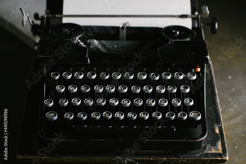 Vintage typewriter on wooden table photo