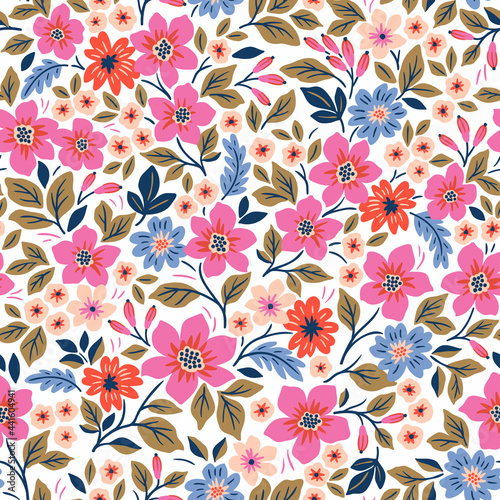 Seamless floral pattern. Ditsy background of small pink and blue flowers. Small-scale flowers scattered over a white background. Stock vector for printing on surfaces and web design.