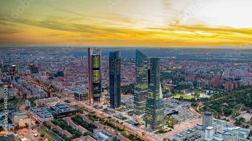 Vistas de las cuatro torres durante el atardecer en la ciudad de Madrid durante un día soleado y sin nubes, España. photo