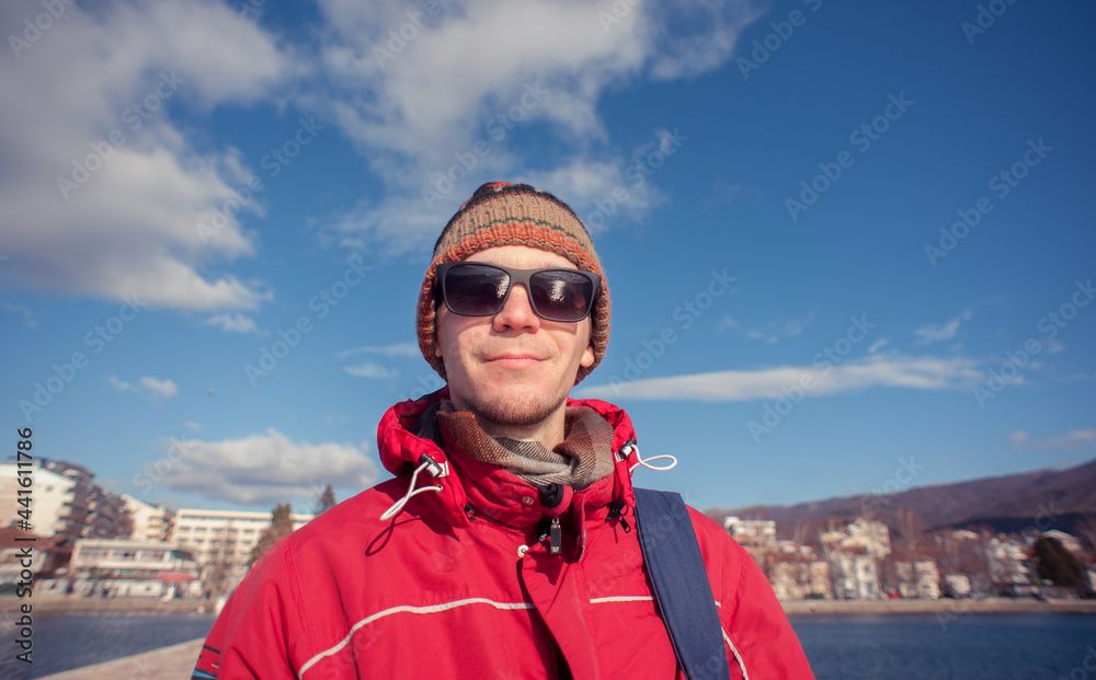 Portrait of a young man at Ohrid Lake (Ohridsko Jezero) during winter months Portrait of a young man at Ohrid Lake (Ohridsko Jezero) during winter months