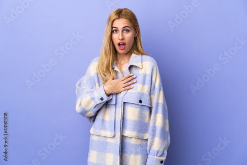 Young Uruguayan blonde woman over isolated background pointing to oneself